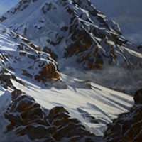 whispy clouds embrace the mountain